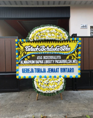 Papan Bunga Duka di Warung Muncang